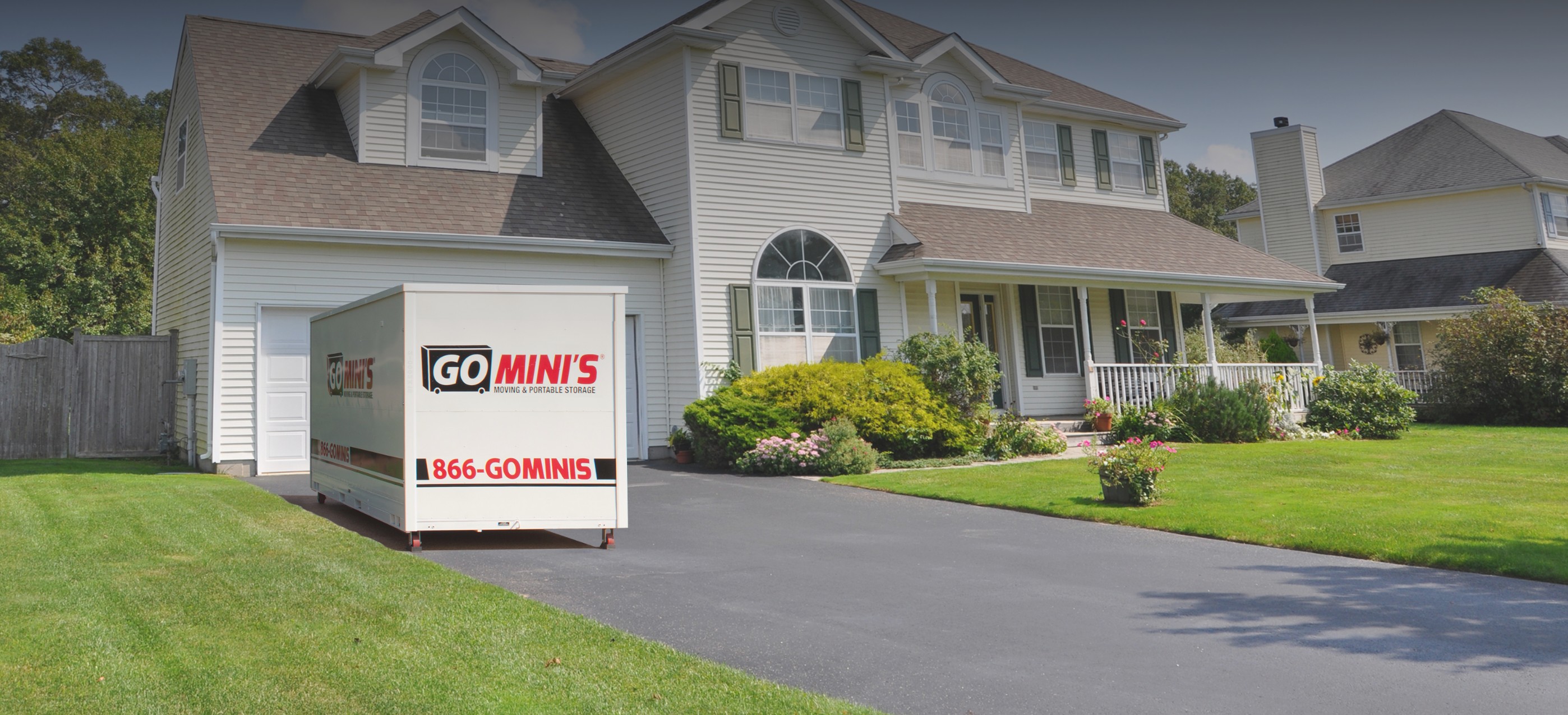 Go Minis container in front of a house