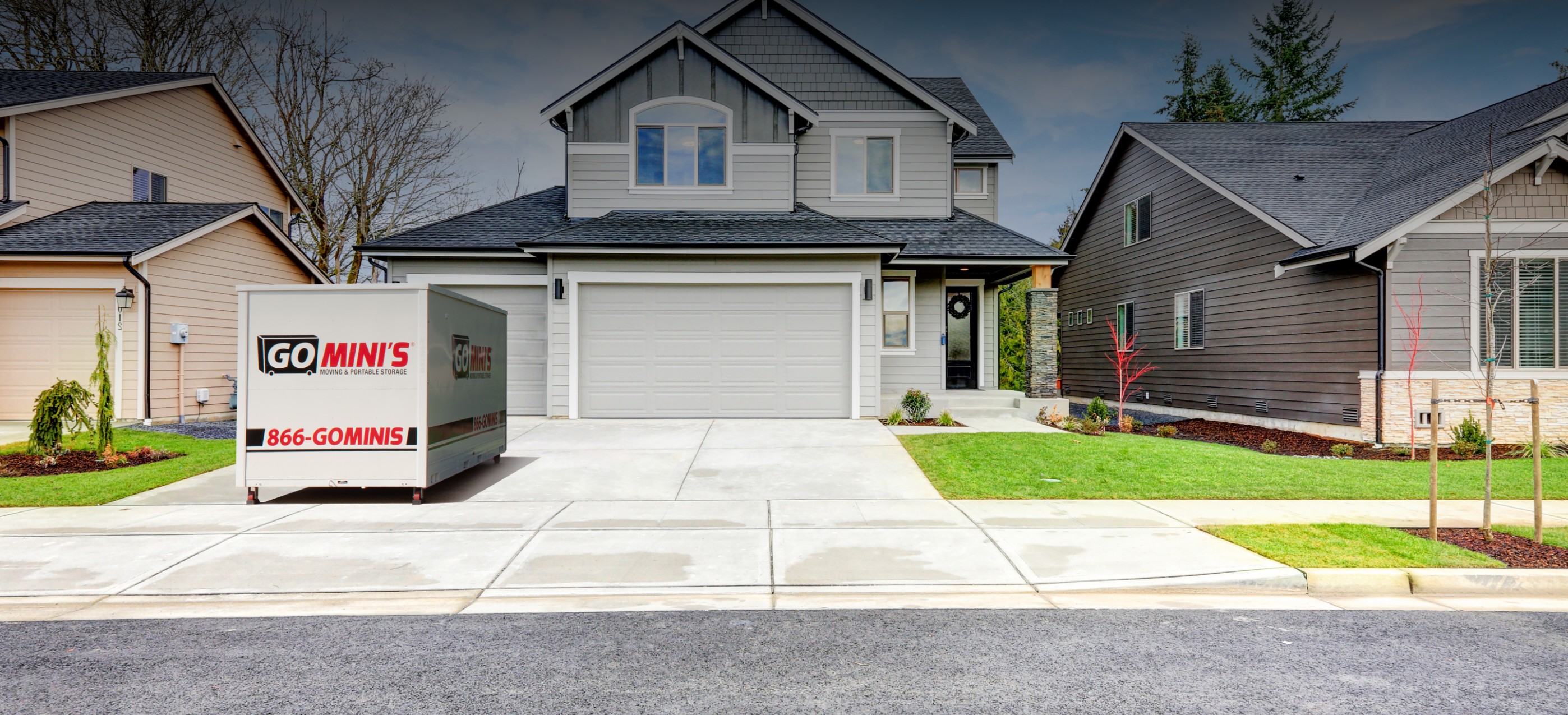 house with go minis container in driveway