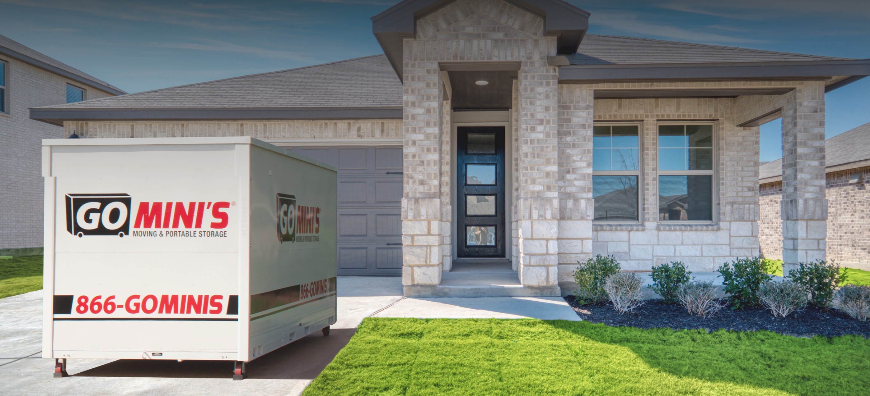 Go Minis container in front of a house