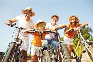 A family riding bikes together in the summer, representing fun summer activities in the CSRA and Columbia