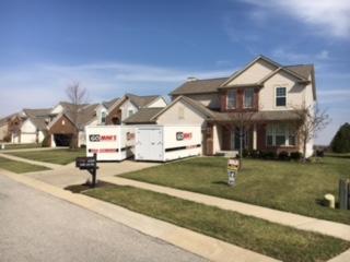 Go Mini's unit's in front of house