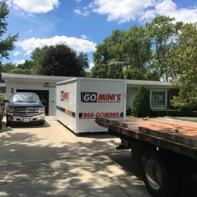 go minis unit on driveway with truck