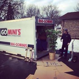 go minis unit on driveway being loaded in the snow