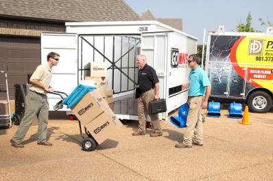 Team unloading Go Mini's unit